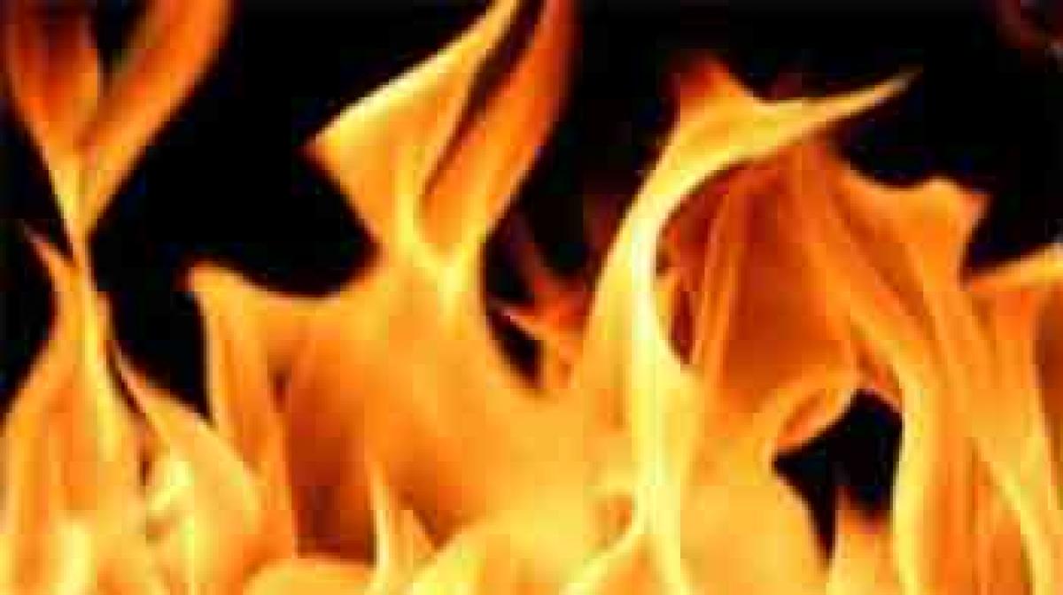 Woman ends life by jumping into brothers burning pyre