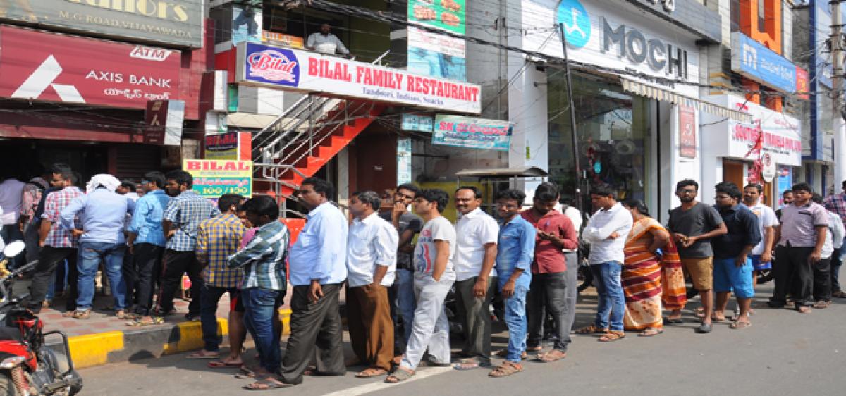 Serpentine queues at banks, ATMs