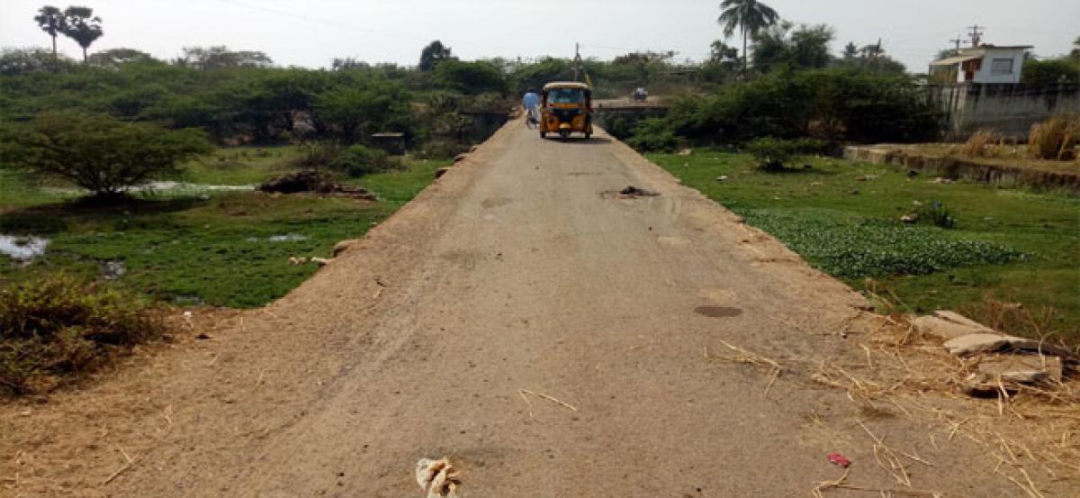 Low bridge sans railings, pose threat to users