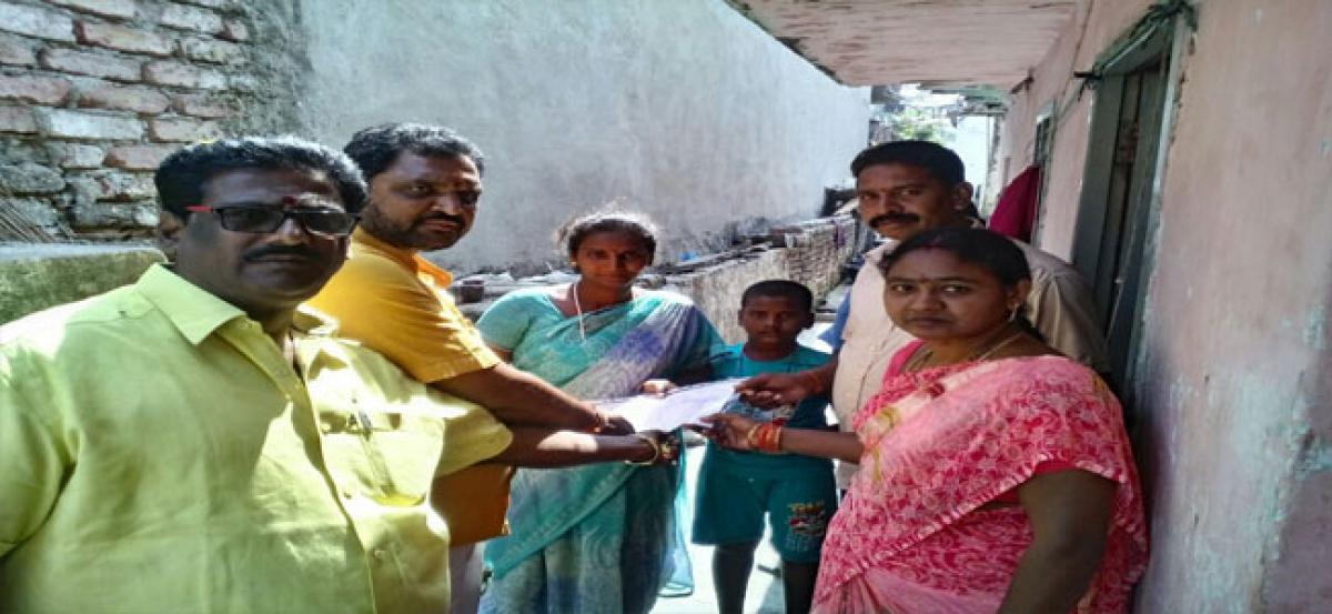 Sarpanch disburses Chandranna Bheema cheques