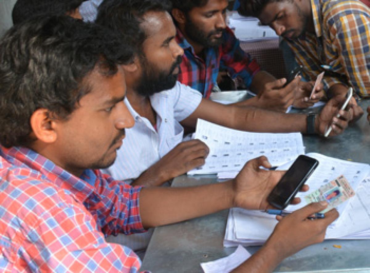 Youngsters help people find names in voters list