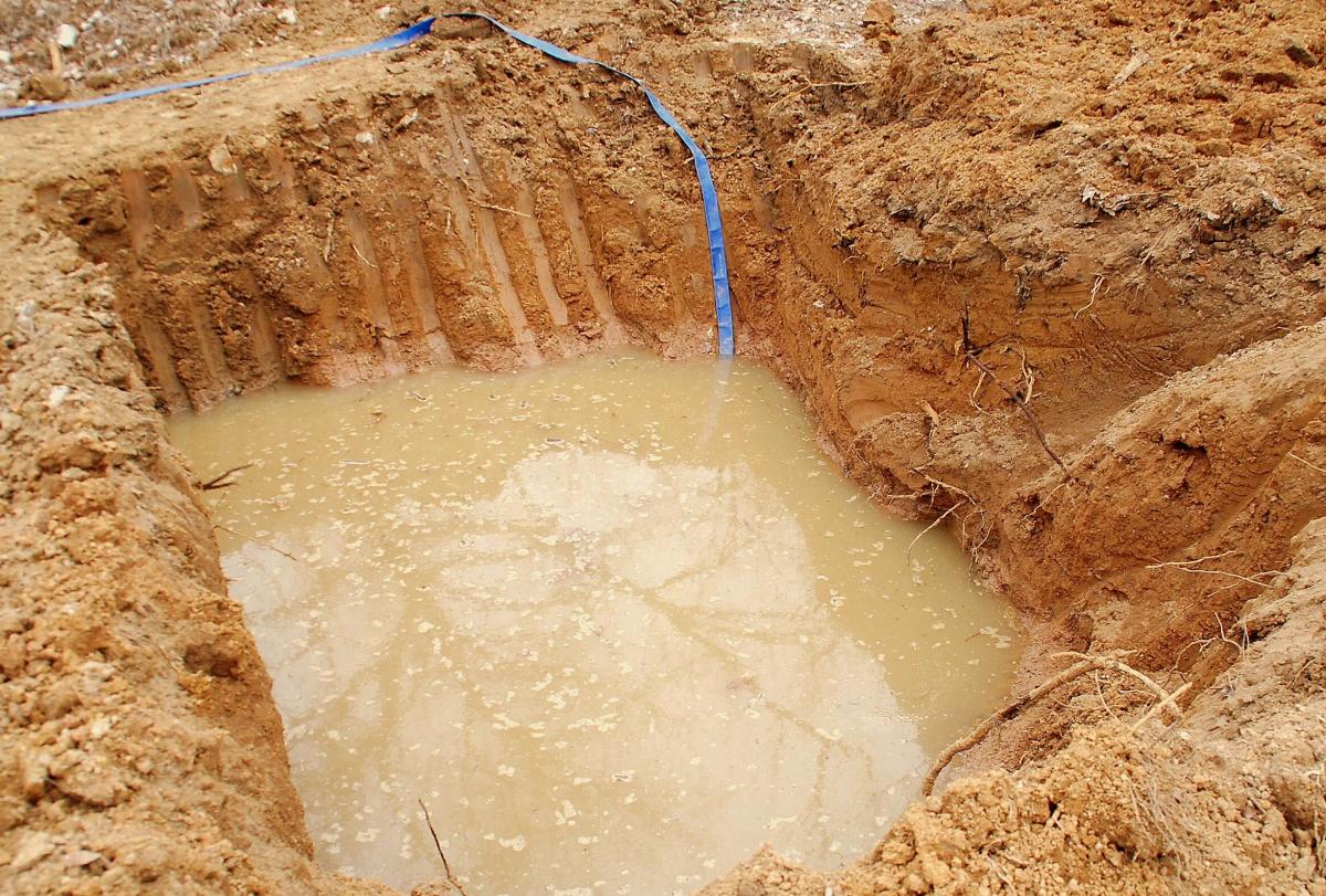 MGNREGS workers dig water conservation pits