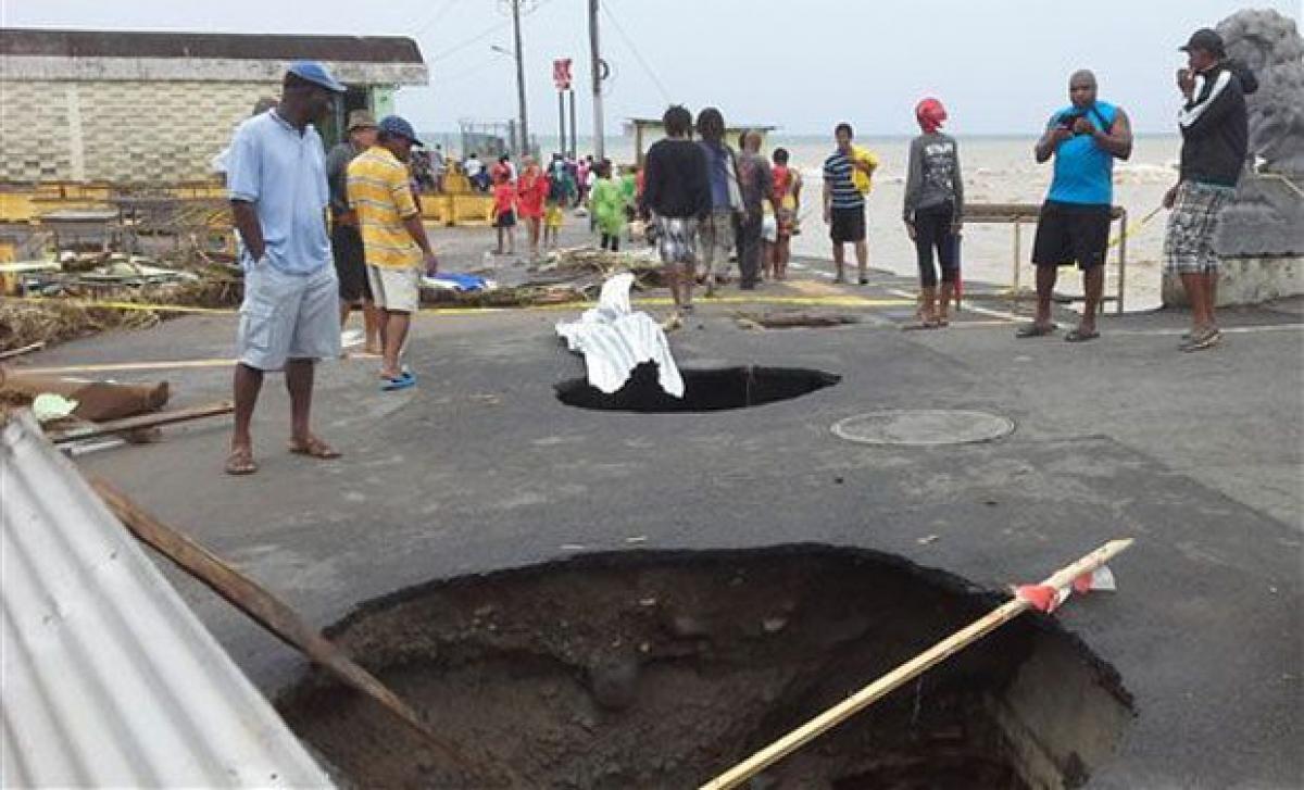 Tropical storm weakens, but leaves 20 dead in Caribbean