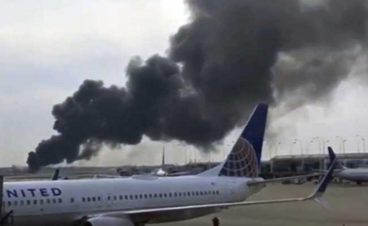 20 injured as plane sparks fire on Chicago runway