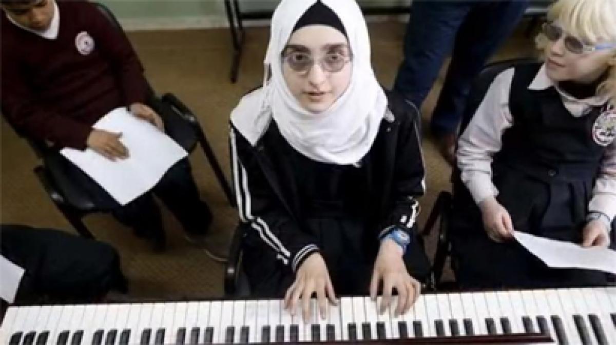 Blind Palestinian students learn English through song