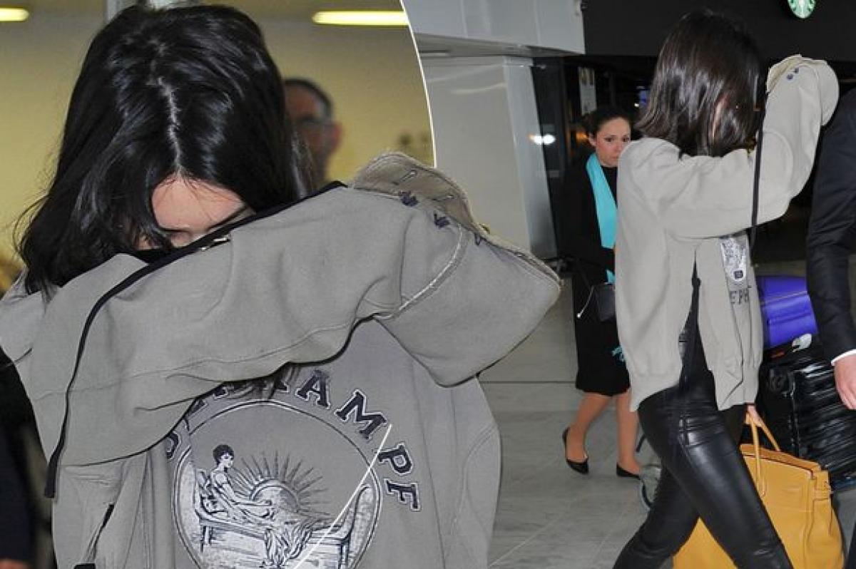 Kendall Jenner covers face as she returns to LA after Pepsi ad row