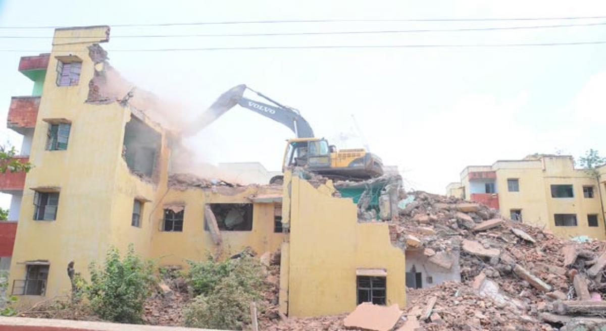 Police quarters demolished for Durga temple flyover.