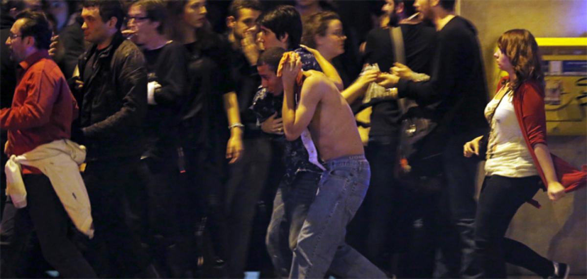 Panic stricken Parisians flee memorial mistaking firecrackers for gunfire