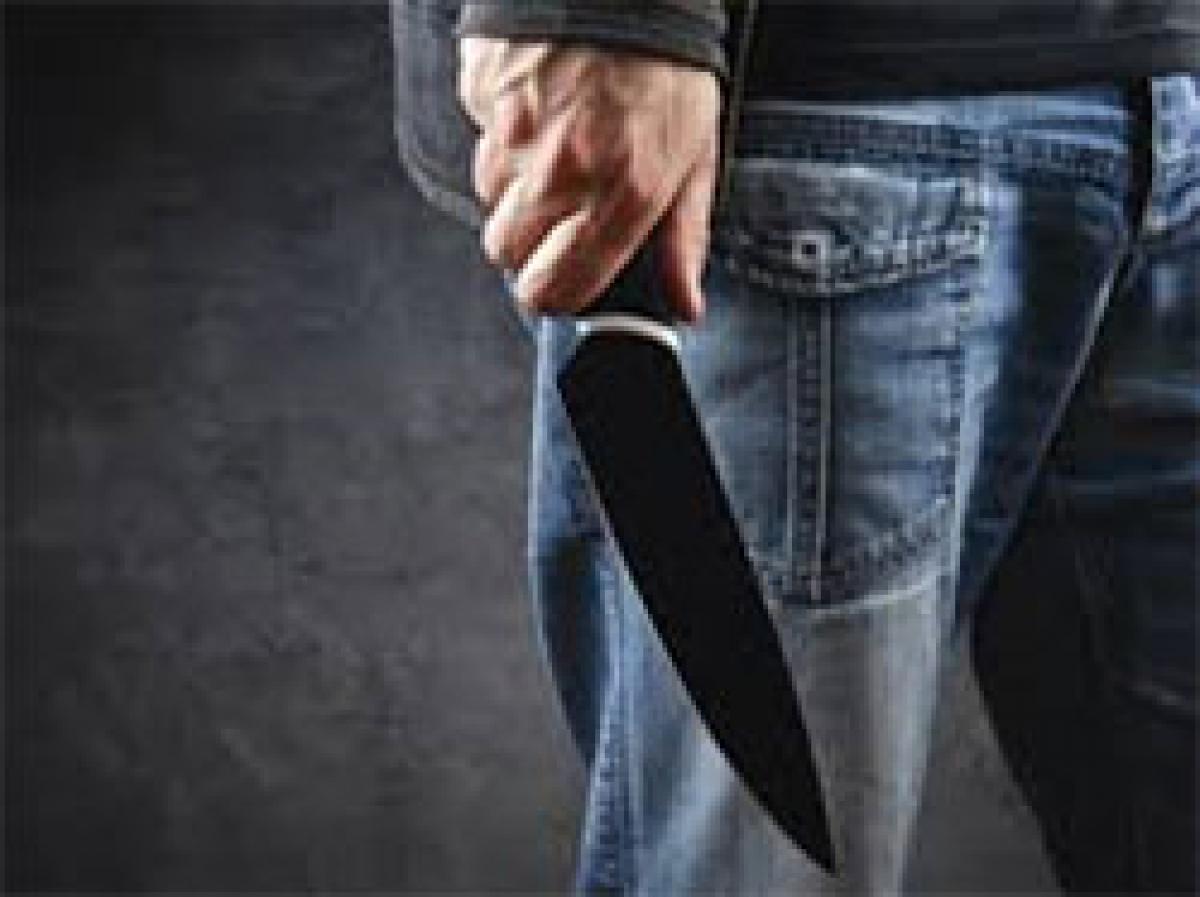 Man attacks wife with knife