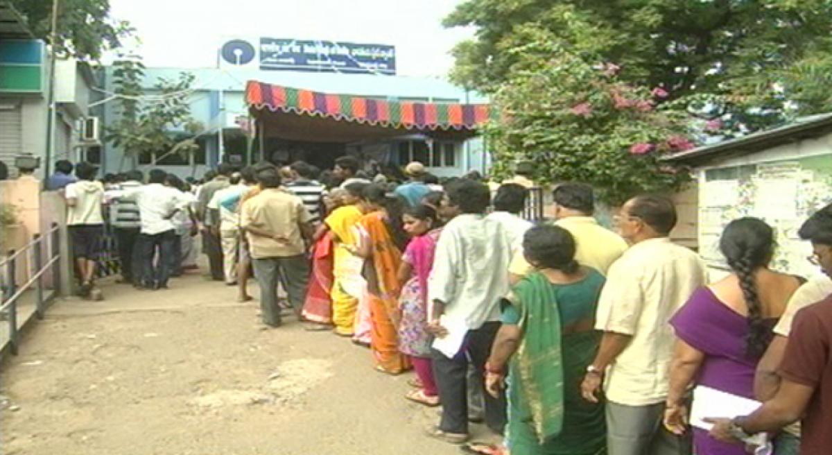 Queue lines at banks grow by the day