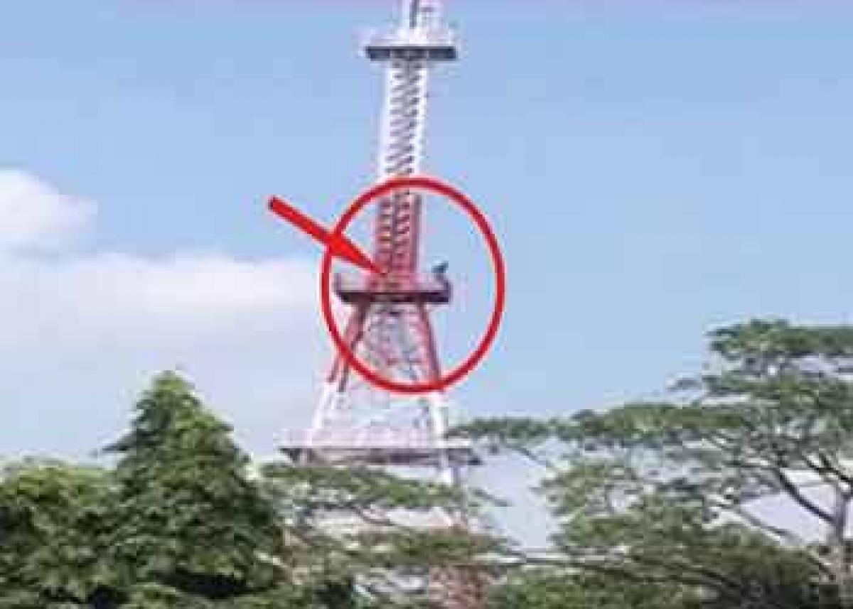 Warangal Farmer climbs phone tower near Assembly, threatens suicide over crop failure