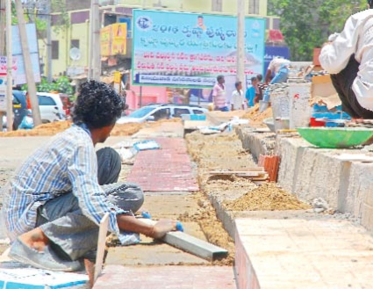 Workers sweat it out to complete works