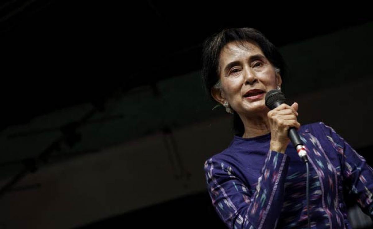 Myanmars Aung San Suu Kyi Says Party Will Run in Election