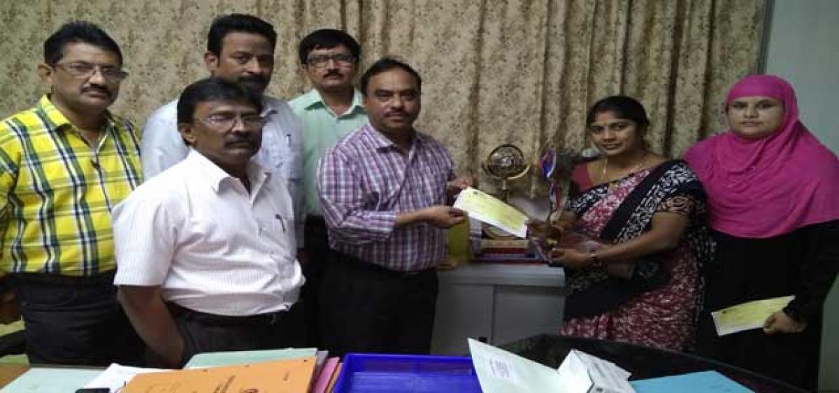 SCCL hands over cheques to professional trainers