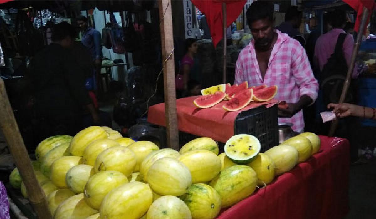 People in awe of yellow water melons