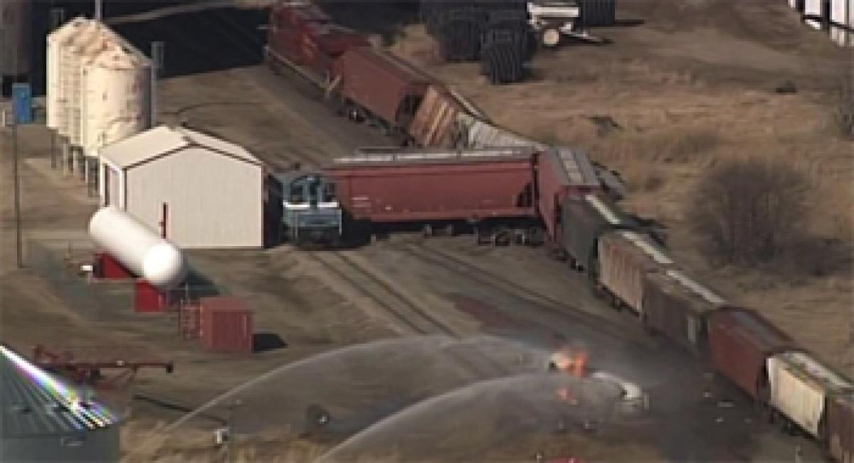 Minnesota town evacuated after train collides with tanker