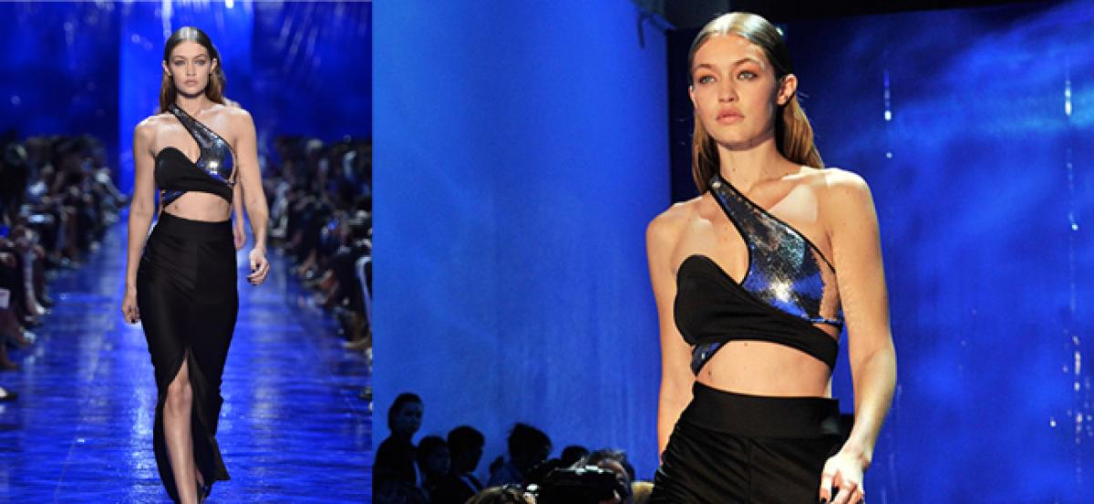 Gigi Hadid slips on the ramp at Paris Fashion Week 