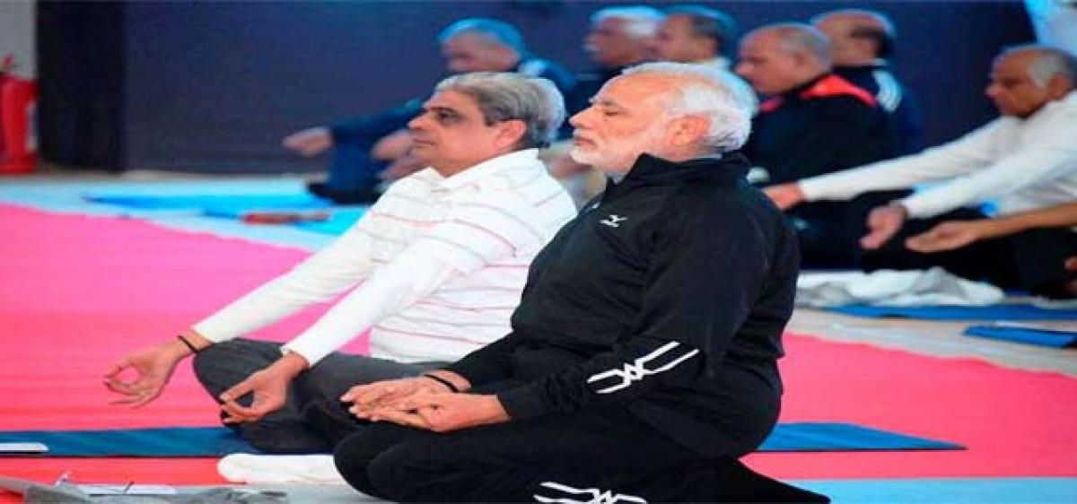 Modi takes to Yoga mat with top cops