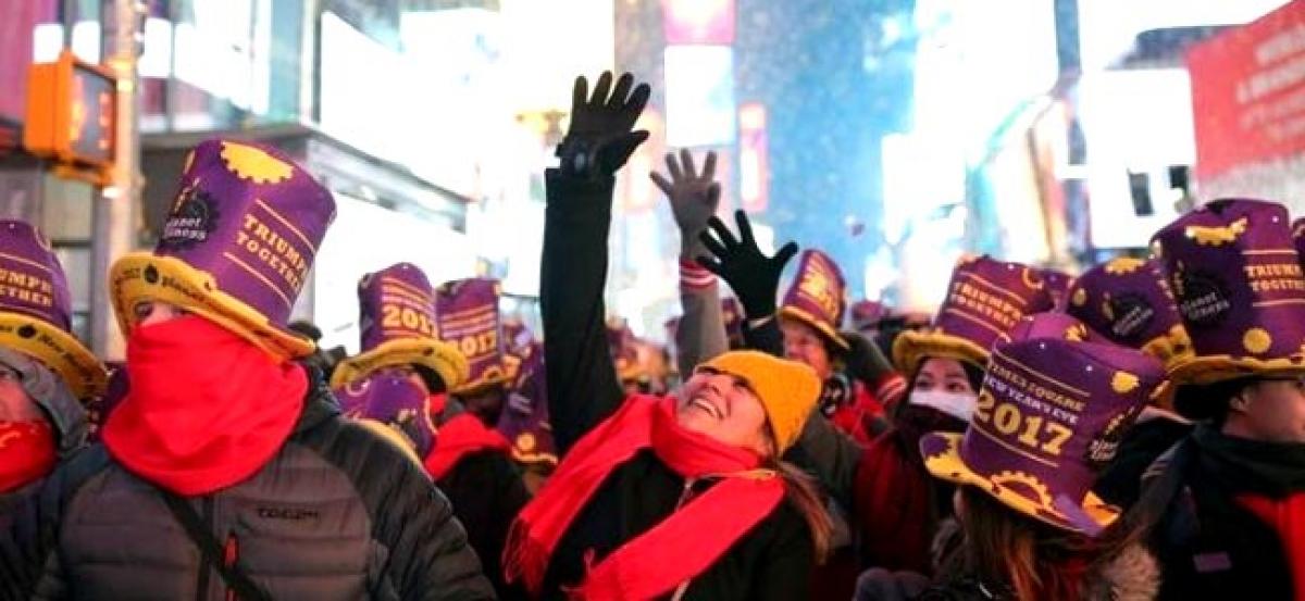 New Yorks Times Square erupts with cheer as a new year dawns