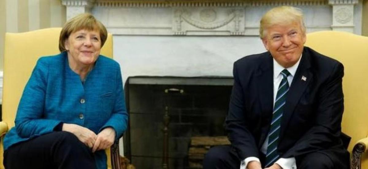 In first Trump-Merkel meeting, awkward body language and a quip