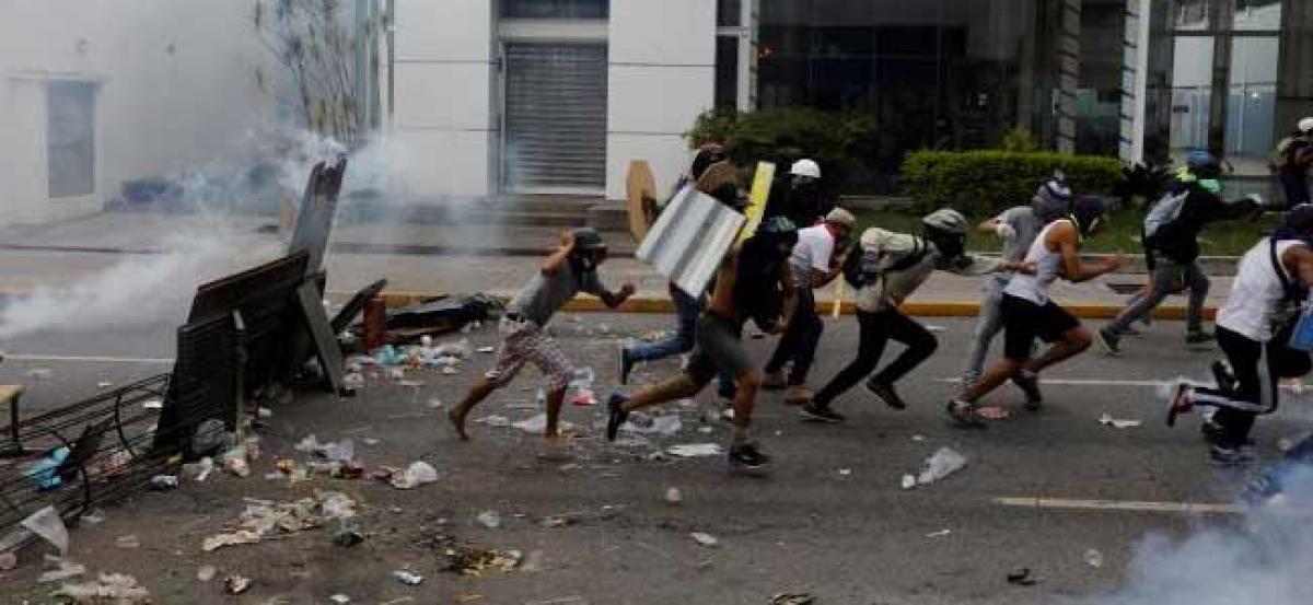 Venezuelan opposition blocks streets to protest Maduro power shakeup