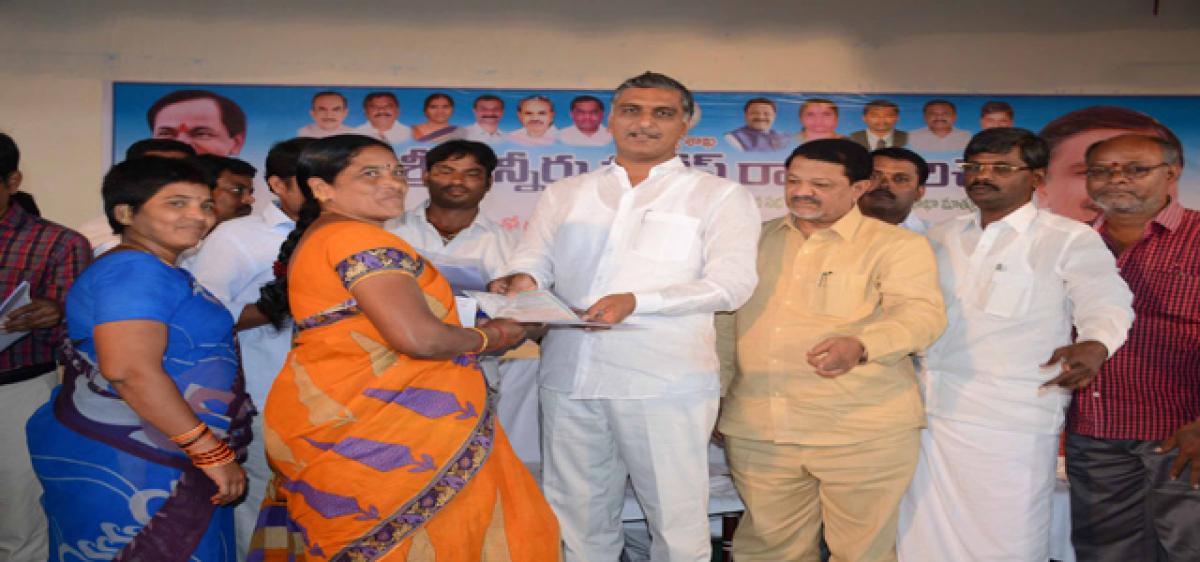 4,031 houses regularised; Harish hands over pattas to owners