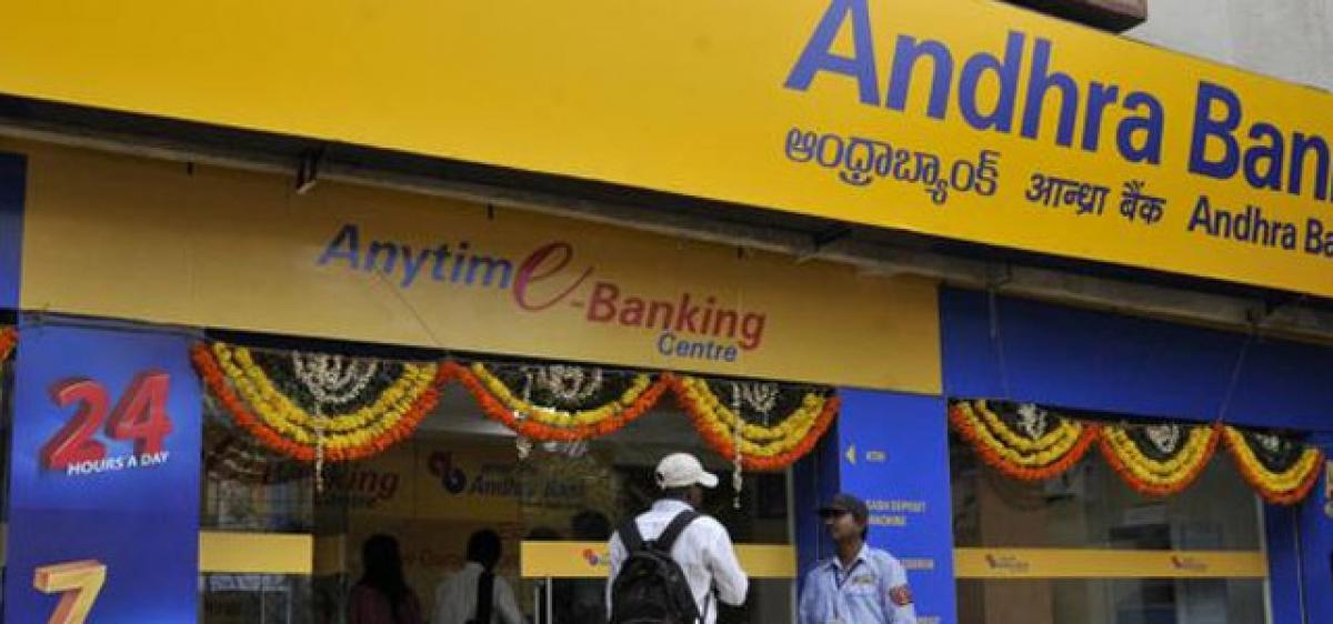 Andhra Bank officials gesture to orphan kids