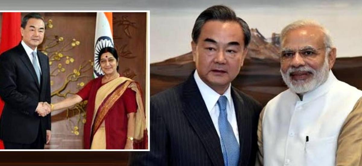 Chinese Foreign Minister meets Modi, Sushma