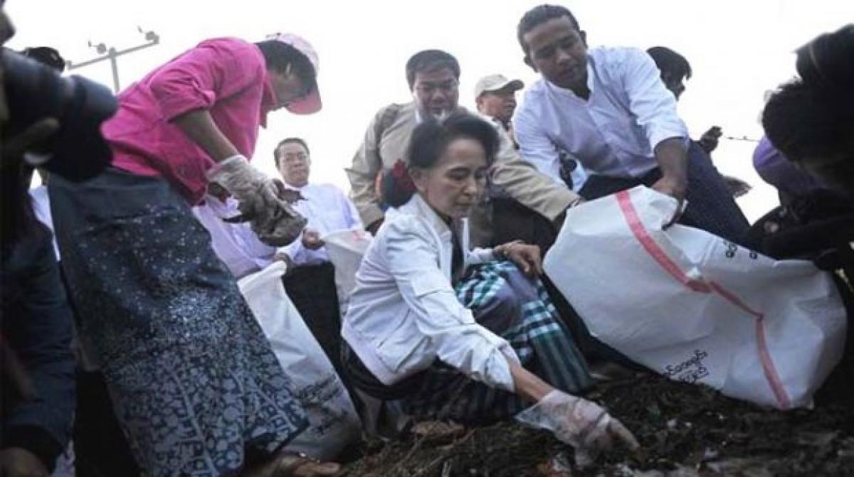 Aung San Suu Kyis NLD party members clean up streets in Myanmar