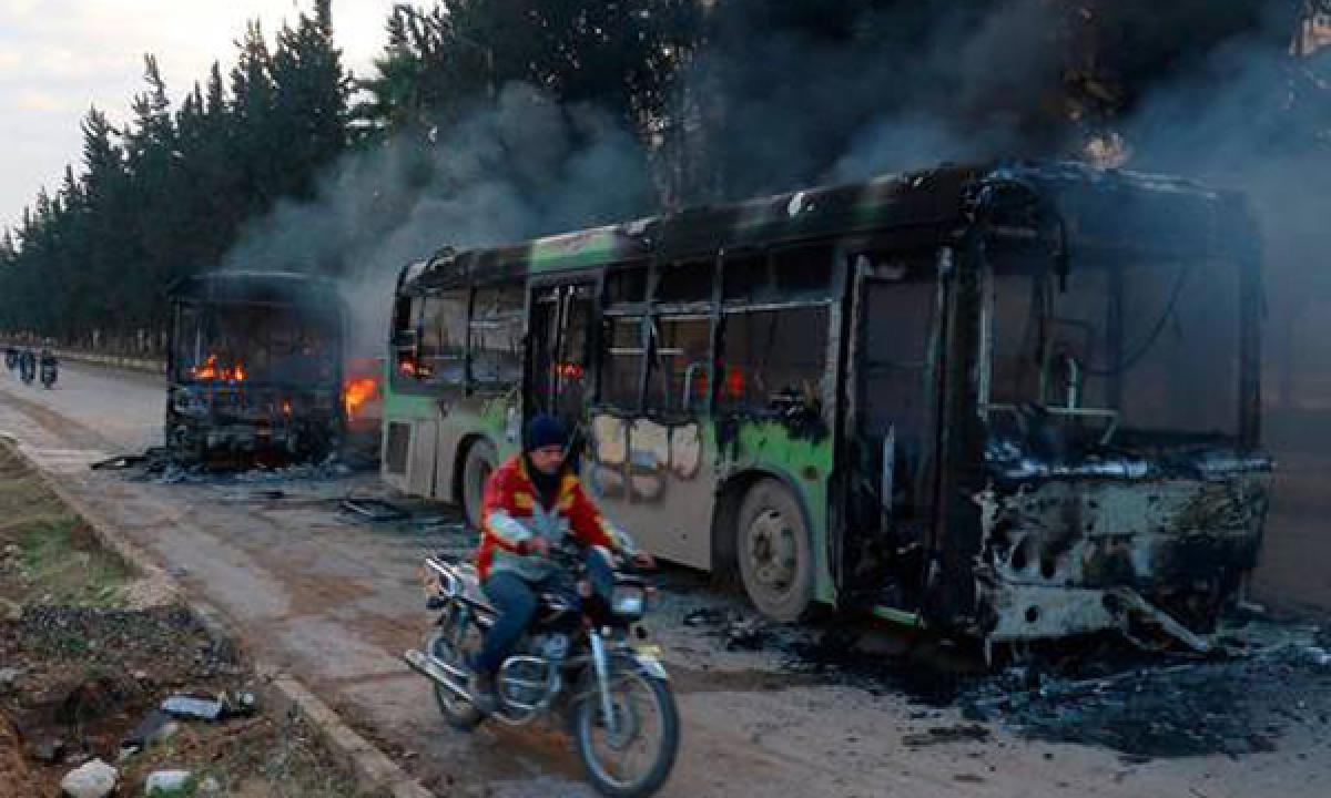 Gunmen burn buses, hindering Aleppo evacuation deal in Syria