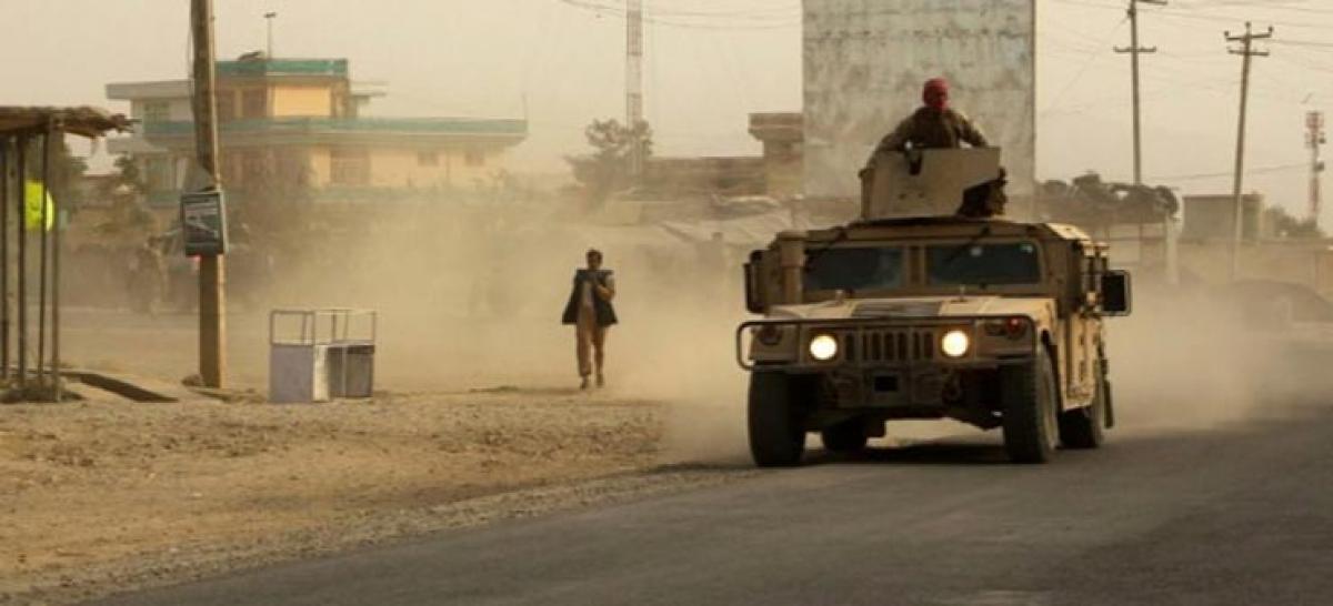 Afghan forces plan fight back after Taliban overrun key city