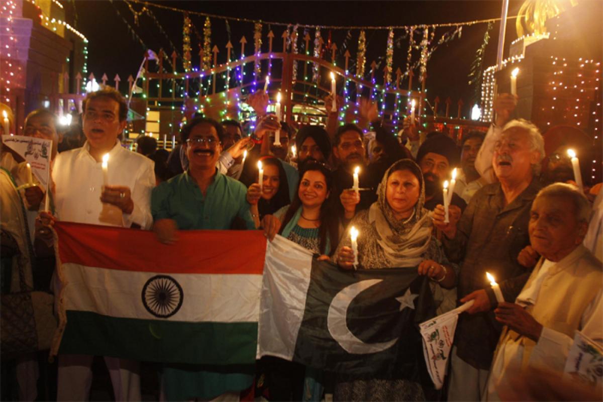 Peaceniks from India, Pakistan take part in candle light vigil at Wagah-Attari border check post