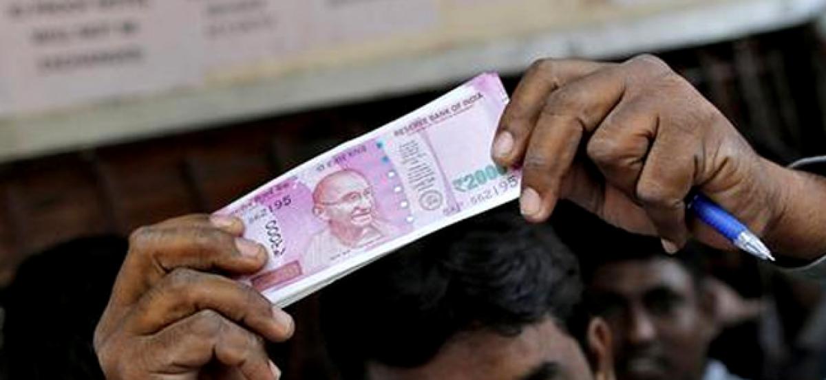 Indias cash crunch seen biting into economic growth - Reuters poll