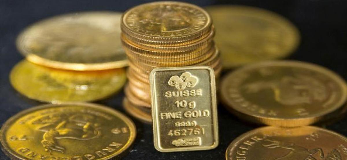 Gold hits one-week high on dollar, political uncertainty