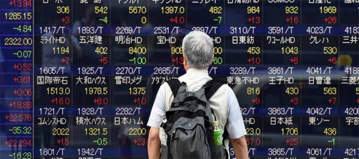 Tokyo shares end higher