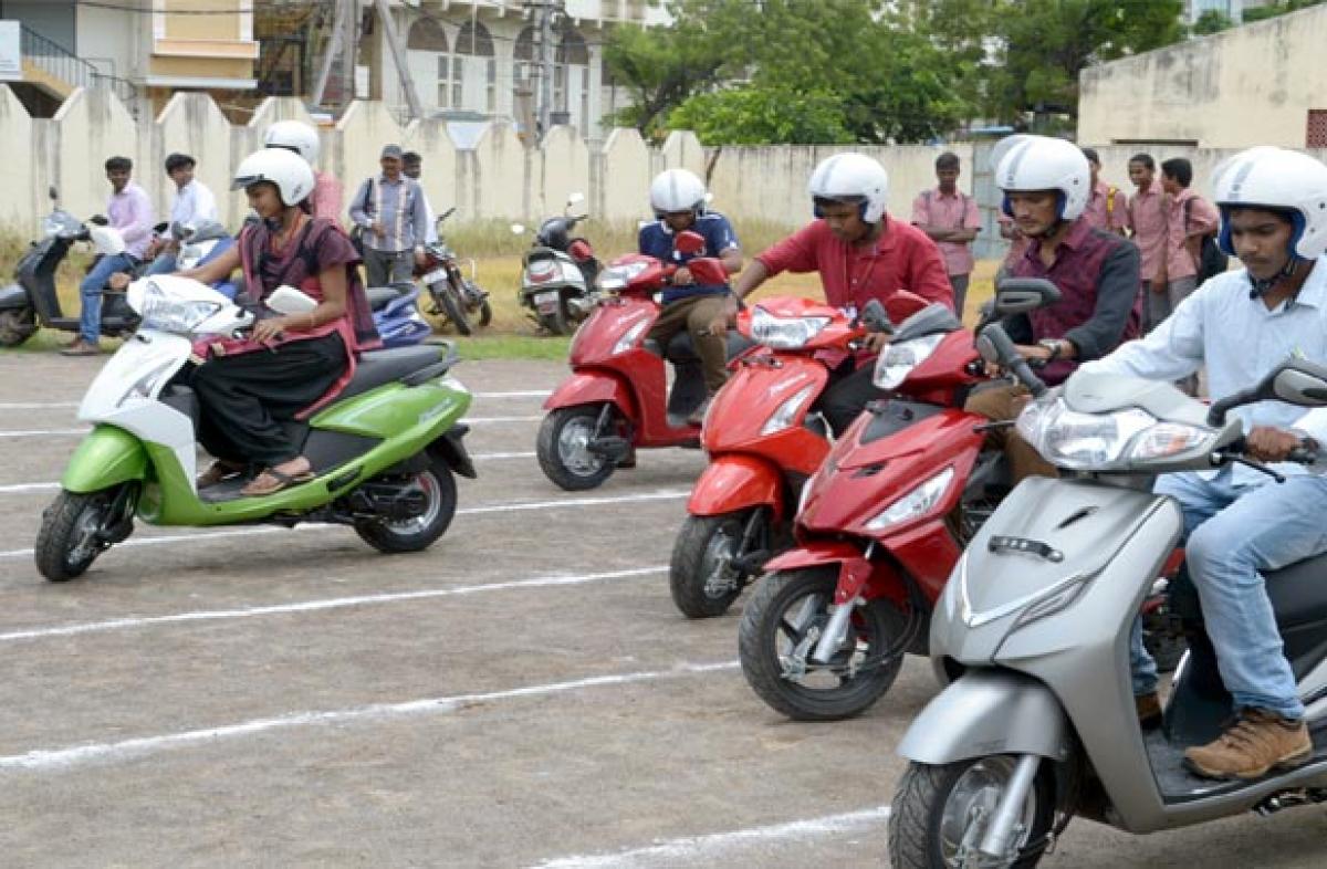 Scooter racing helmet awareness drive held