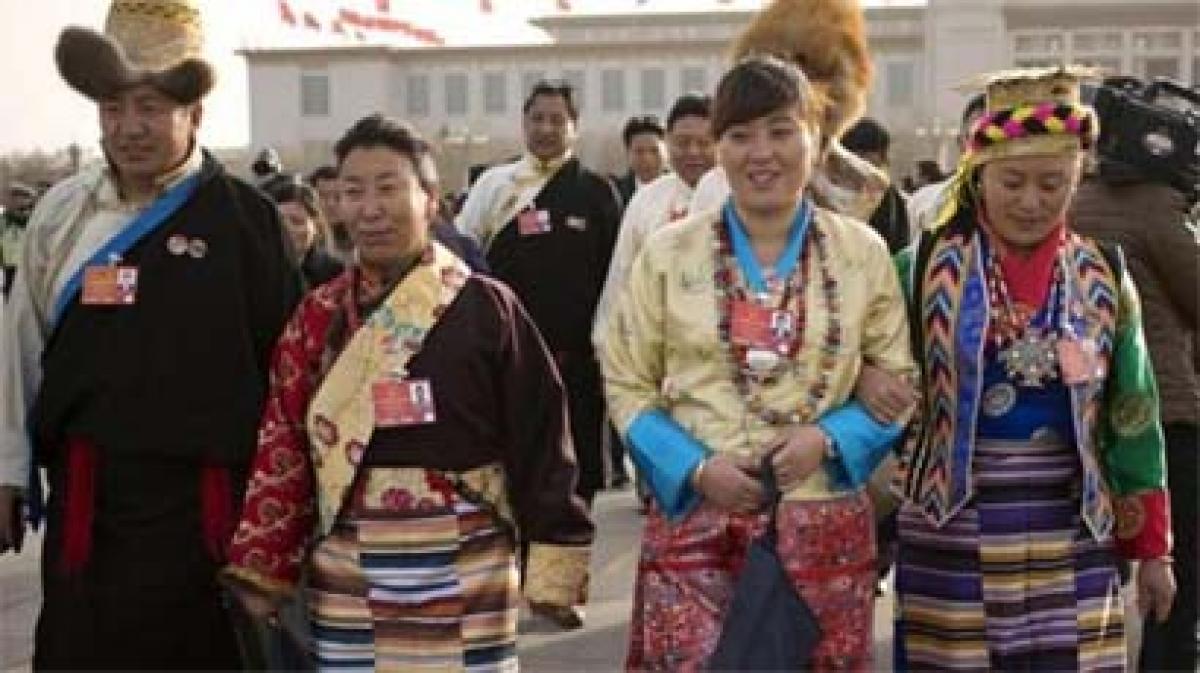 Tibetan delegates to China congress wear loyalty pins