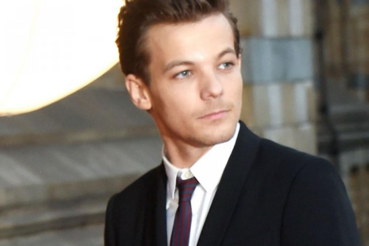 Louis Tomlinson taken into custody over altercation with paparazzi