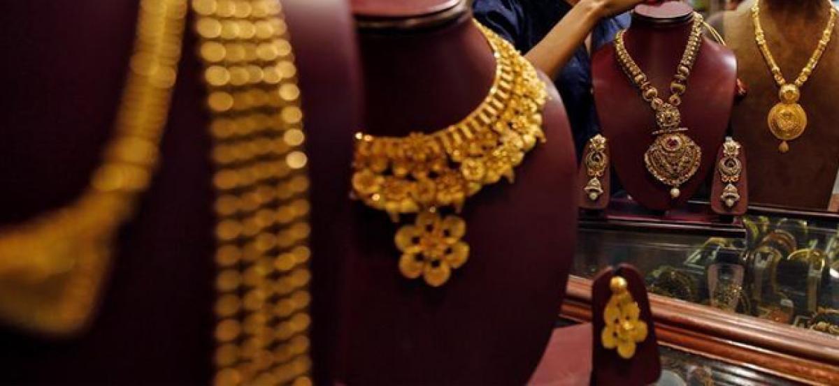 Lower prices nudge gold demand; Indian buyers stay off