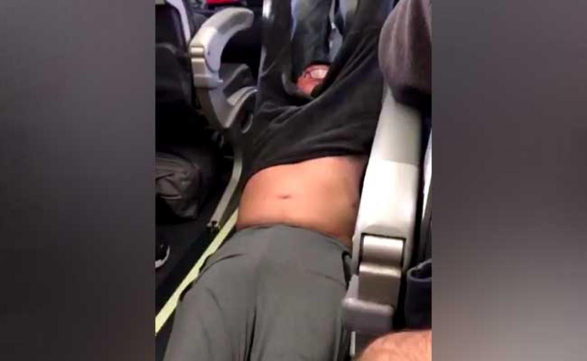 Video: Asian doctor dragged, thrown out of overbooked flight in US