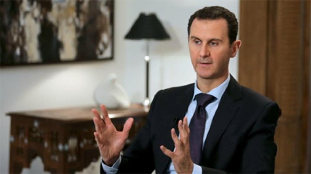 Syrias Bashar al-Assad says willing to hold early presidential vote