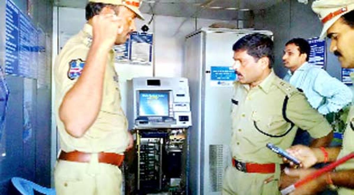 Two SBI ATMs burgled, `40.5 lakh stolen