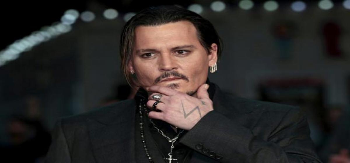 Broke Depp fires agent?