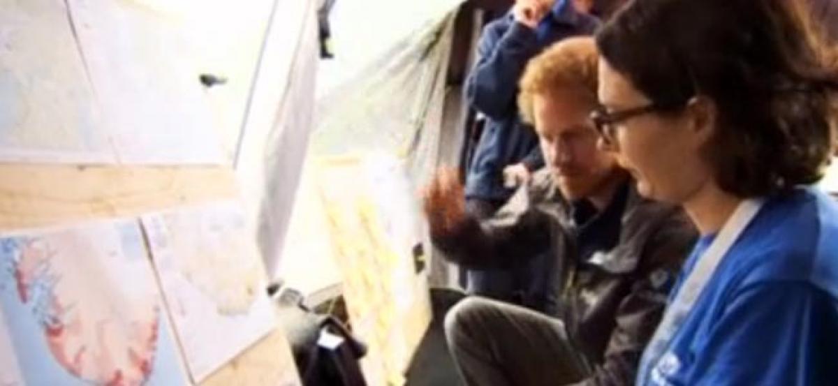 Britains Prince Harry surprises mapping aid workers during drill