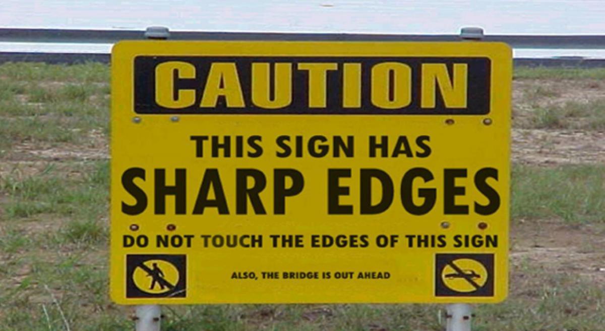 Funny signs–Keep your eyes on the curves!