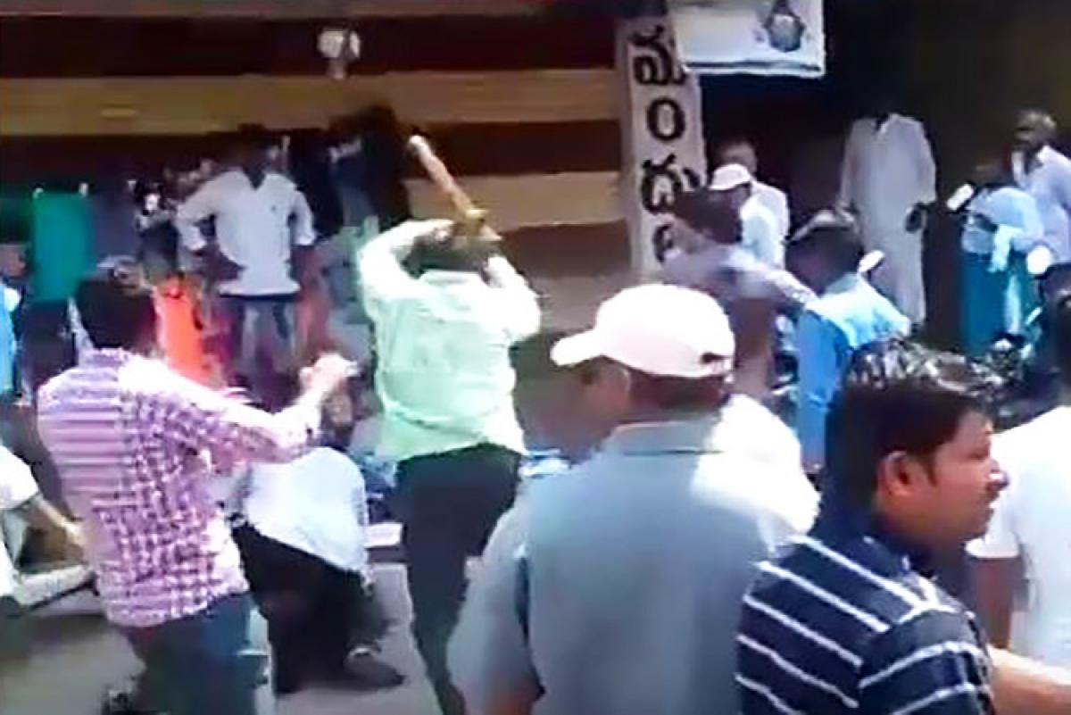 TDP MLAs brother beats up journalist in public