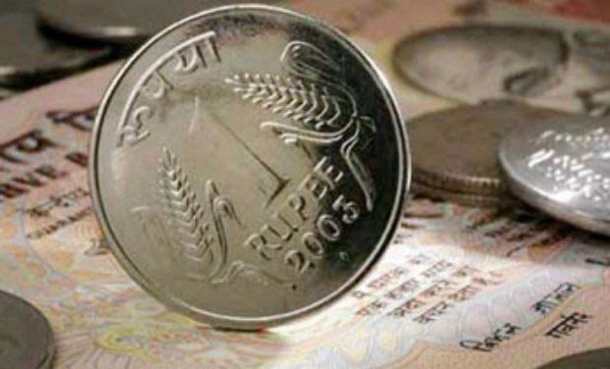 Rupee still down by 12 paise vs US dollar in late morning deals