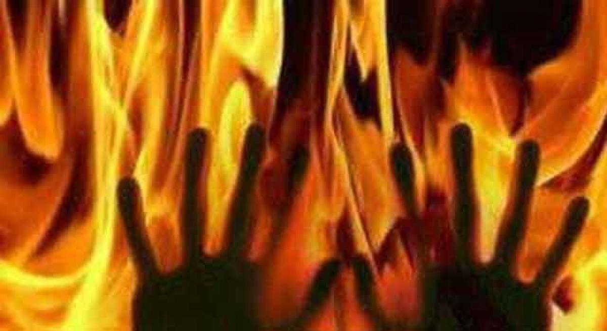 Housewife set ablaze by neighbours