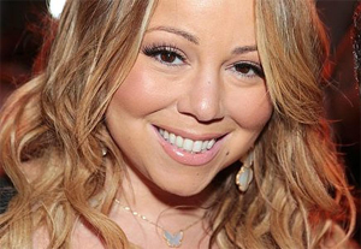 Who crashed Mariah Careys Hollywood walk of fame moment?