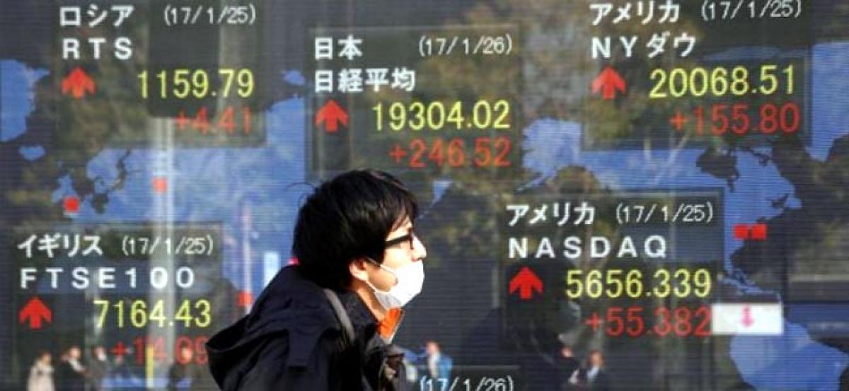 Asia stocks set for best week since July, dollar dips further after Fed